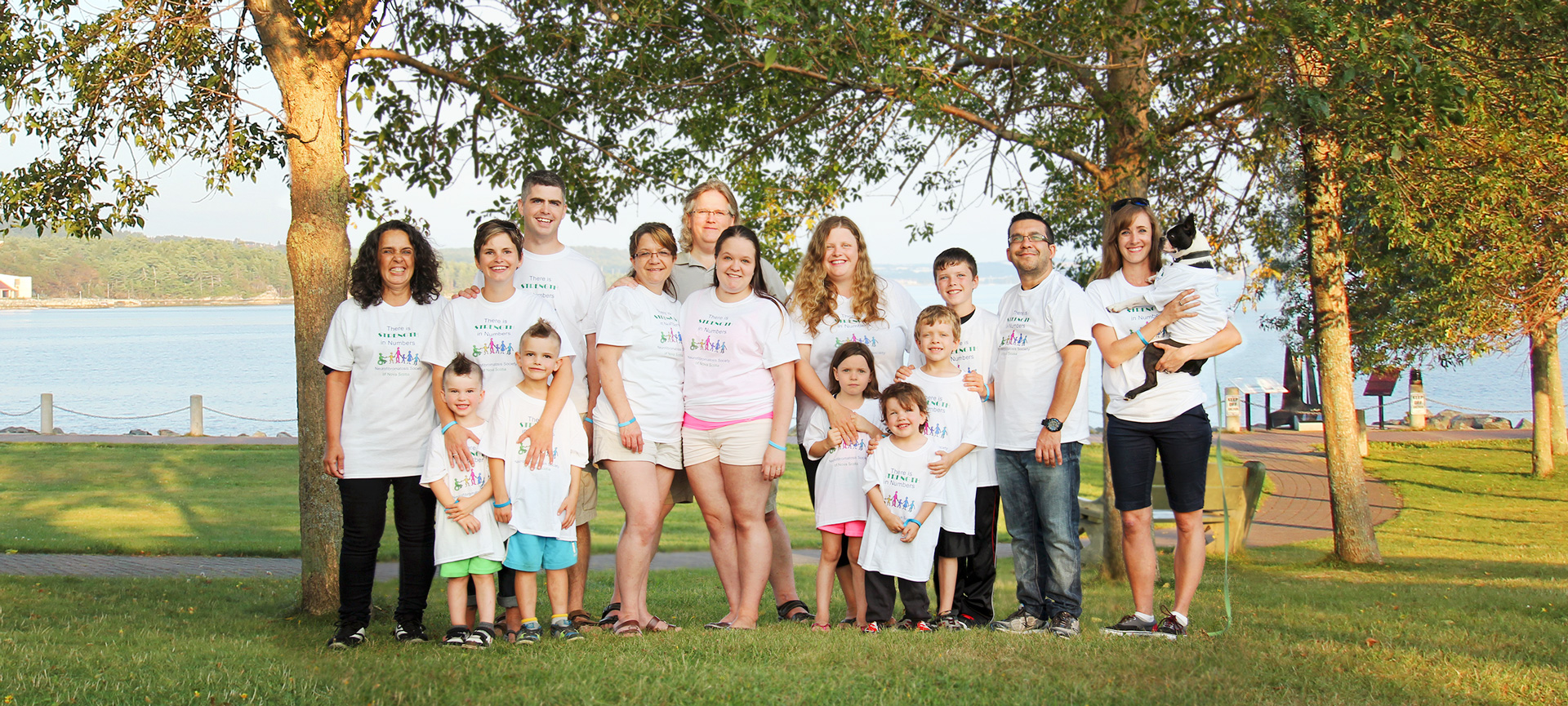 Group of smiling people who are living with various types of NF